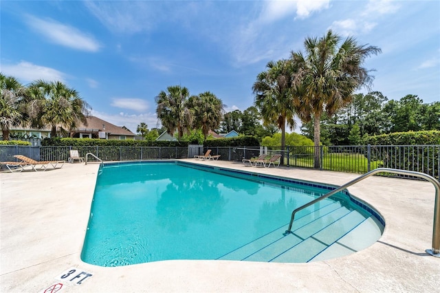 view of swimming pool featuring a patio area