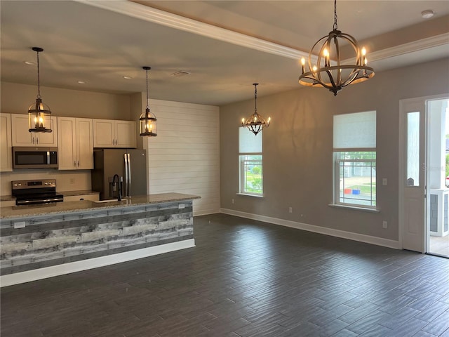 kitchen featuring a chandelier, stainless steel appliances, baseboards, light stone countertops, and dark wood-style floors