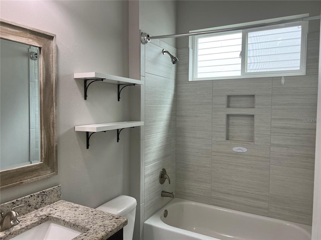 full bathroom with bathing tub / shower combination, toilet, and vanity