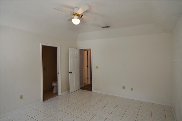 unfurnished room featuring light tile patterned floors, ceiling fan, visible vents, and baseboards
