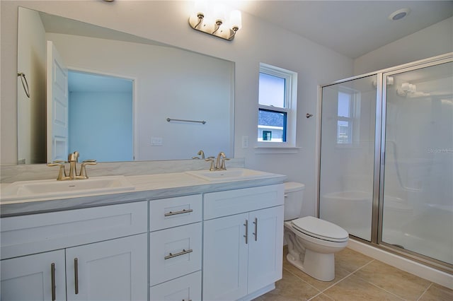 full bathroom with a stall shower, tile patterned flooring, and a sink