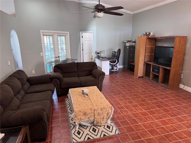 living room with ornamental molding and ceiling fan