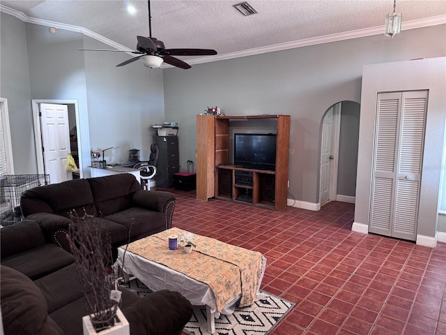 living room with crown molding, a textured ceiling, and ceiling fan