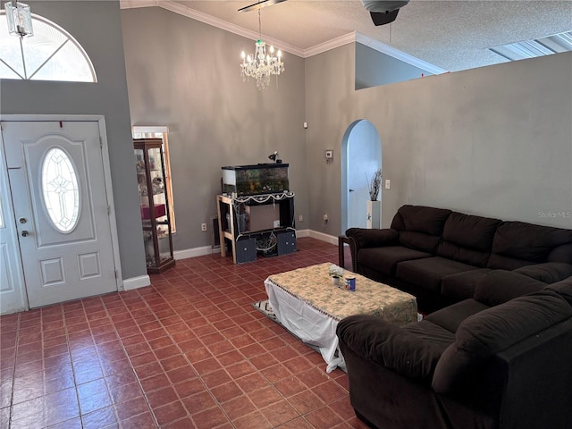 living room with a notable chandelier, crown molding, high vaulted ceiling, and a textured ceiling