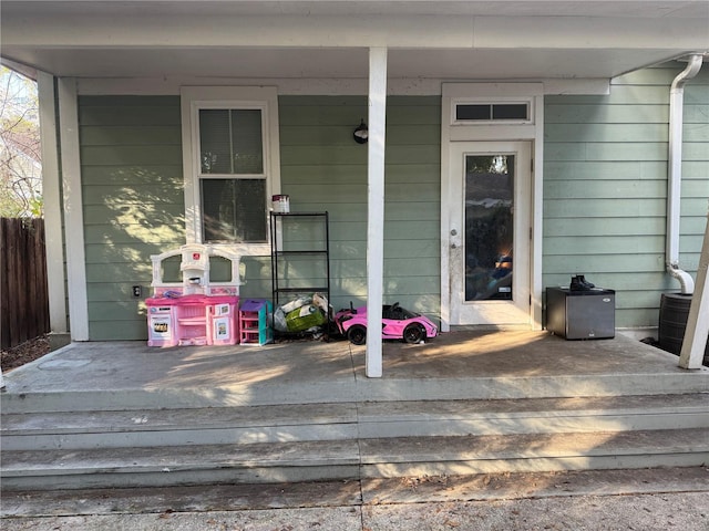 doorway to property featuring covered porch