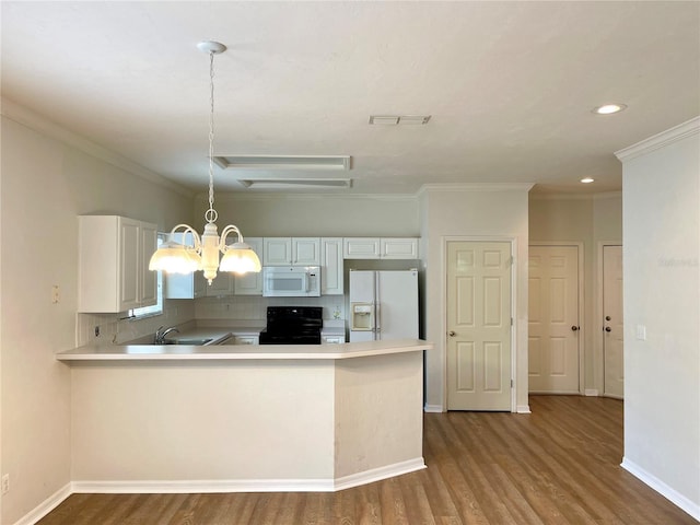 kitchen featuring kitchen peninsula, hanging light fixtures, sink, white appliances, and white cabinets