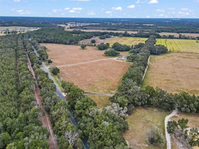 birds eye view of property featuring a rural view