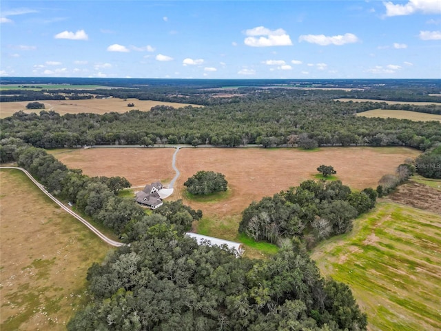 birds eye view of property with a rural view