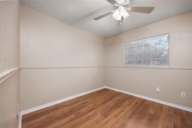 unfurnished room with wood-type flooring, ceiling fan, and a textured ceiling