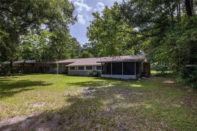 view of yard with a sunroom