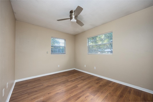 unfurnished room featuring hardwood / wood-style floors, a textured ceiling, and ceiling fan