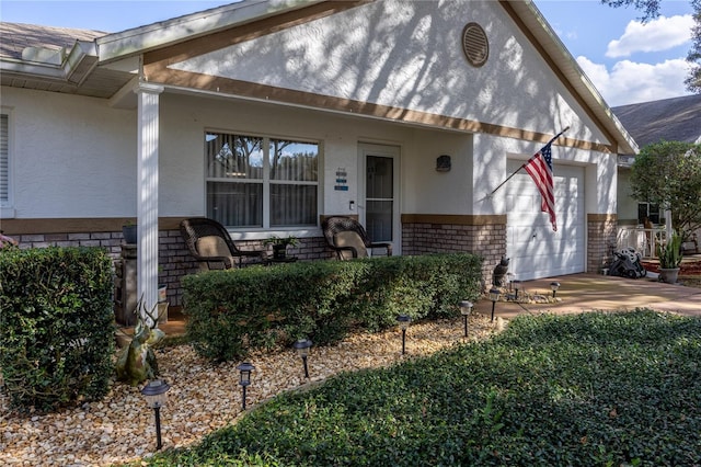 view of front of house with a garage and a porch