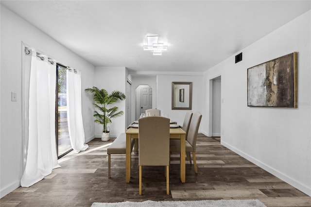 dining space featuring dark hardwood / wood-style flooring