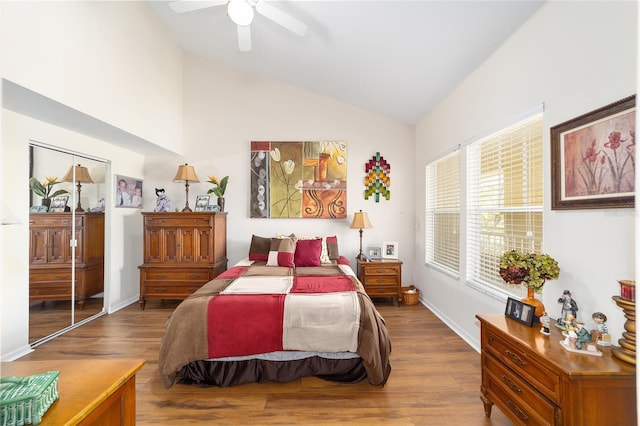 bedroom featuring hardwood / wood-style flooring, ceiling fan, and high vaulted ceiling