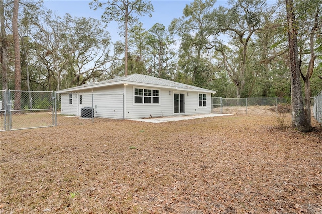 rear view of house featuring a patio area and central air condition unit