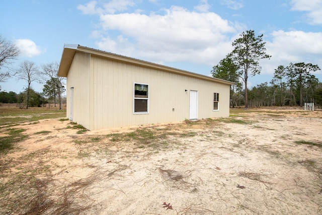 rear view of house with metal roof