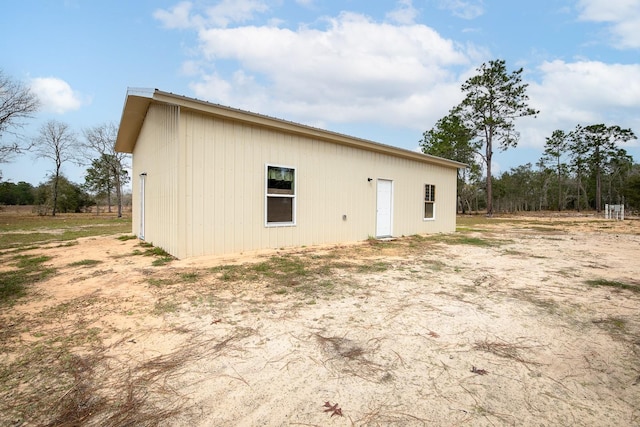 back of property with metal roof