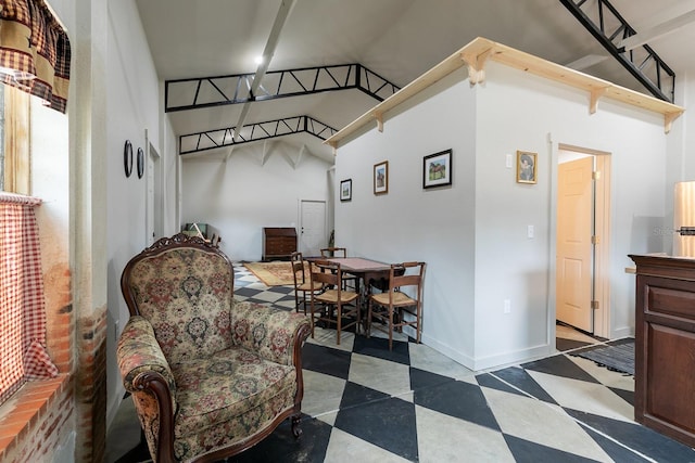 living area featuring tile patterned floors and baseboards