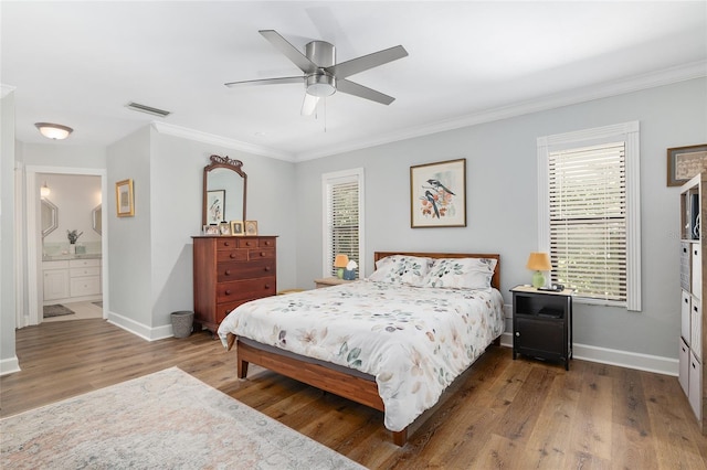 bedroom with crown molding, ceiling fan, and hardwood / wood-style floors