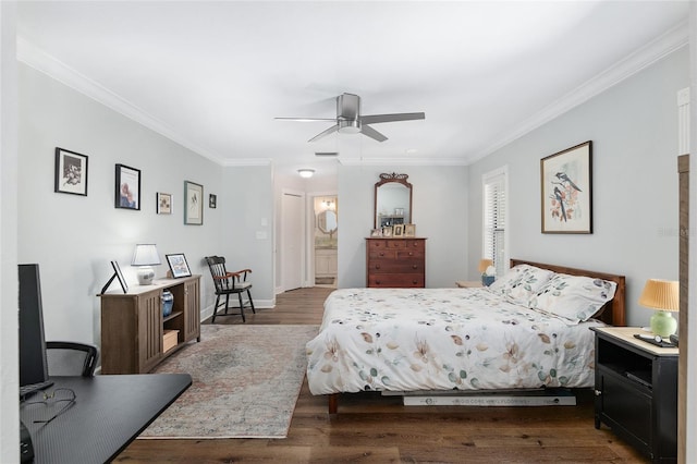 bedroom with dark wood-type flooring, ensuite bathroom, and crown molding