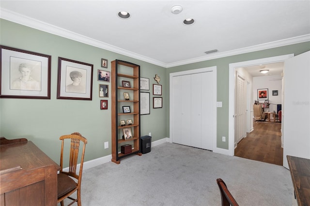 home office featuring crown molding and light colored carpet