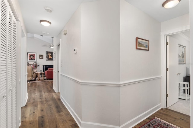 corridor with wood-type flooring