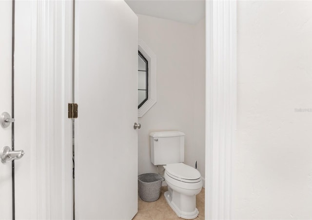 bathroom featuring tile patterned floors and toilet