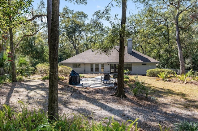 rear view of property with a patio