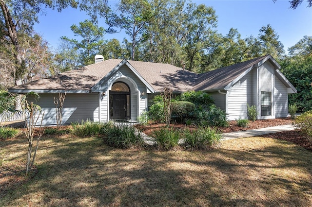 single story home with a front yard