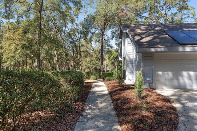 view of property exterior with a garage