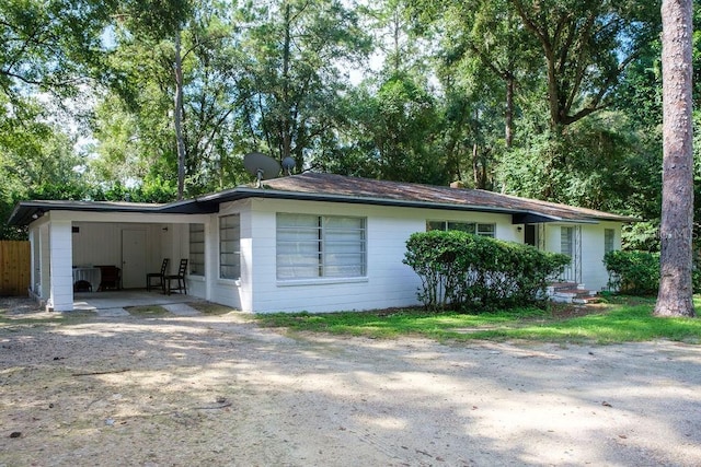 view of front facade with a carport