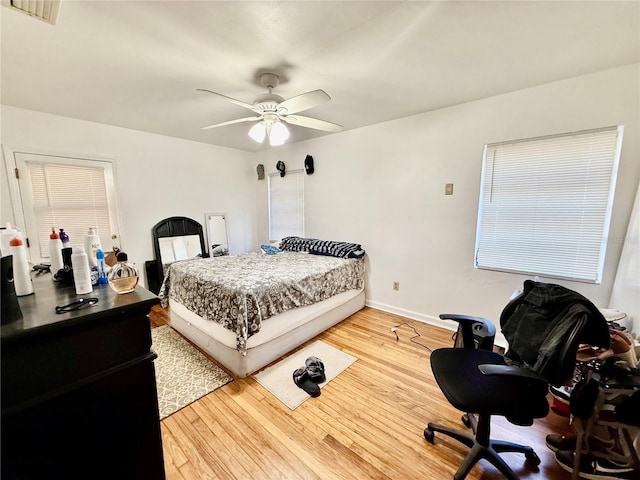 bedroom featuring hardwood / wood-style floors and ceiling fan