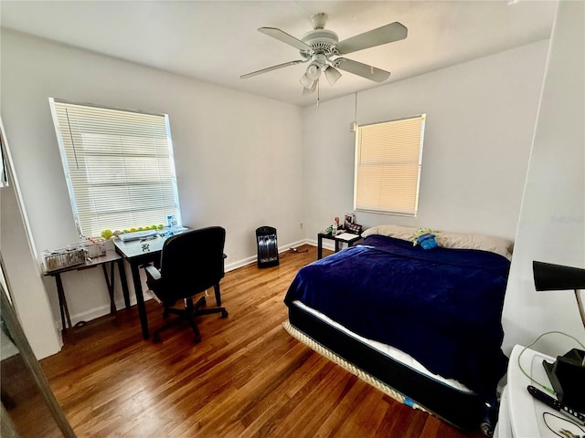 bedroom featuring hardwood / wood-style flooring and ceiling fan