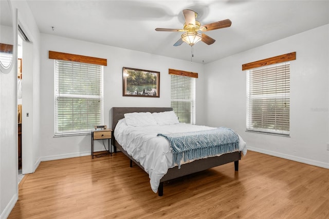 bedroom featuring light hardwood / wood-style flooring and ceiling fan