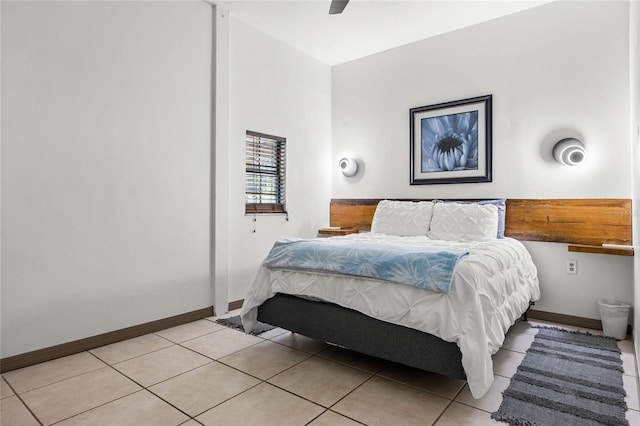 tiled bedroom with ceiling fan