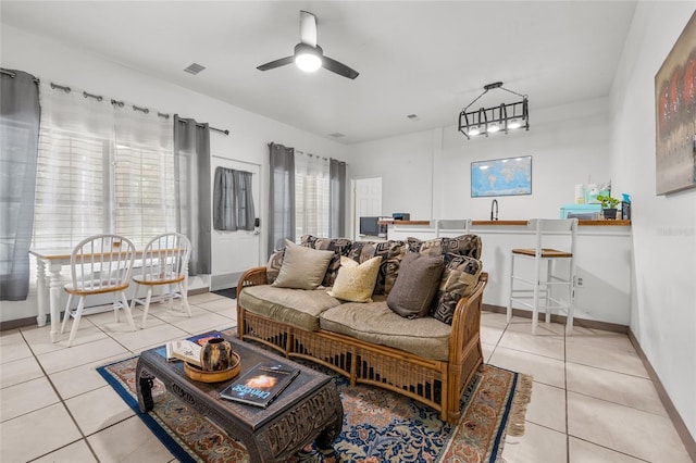 living room with light tile patterned floors and ceiling fan