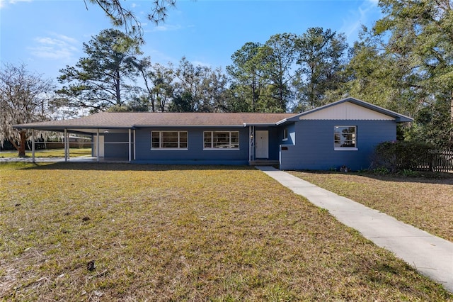 single story home with a front lawn and a carport