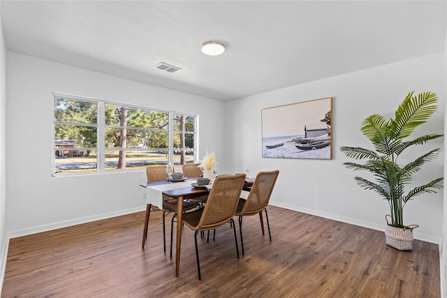 dining area with hardwood / wood-style flooring