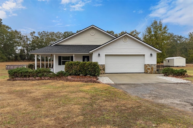 view of front of house with a garage and a front lawn