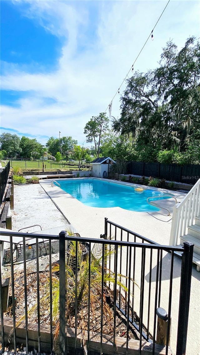 view of pool featuring a patio area