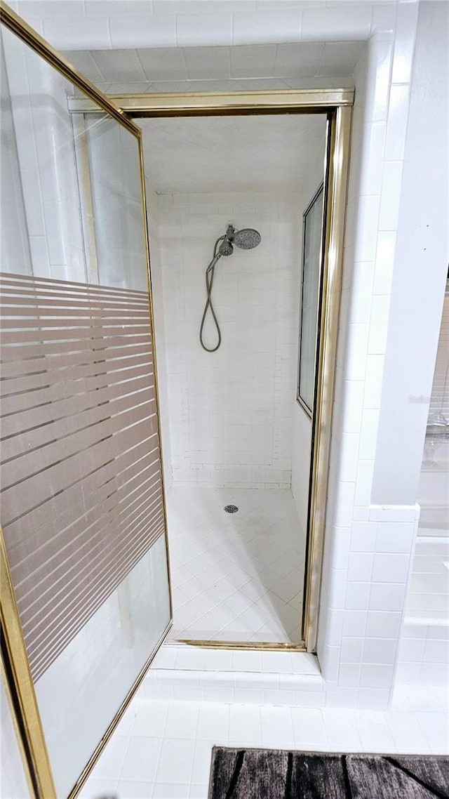 bathroom with a tile shower