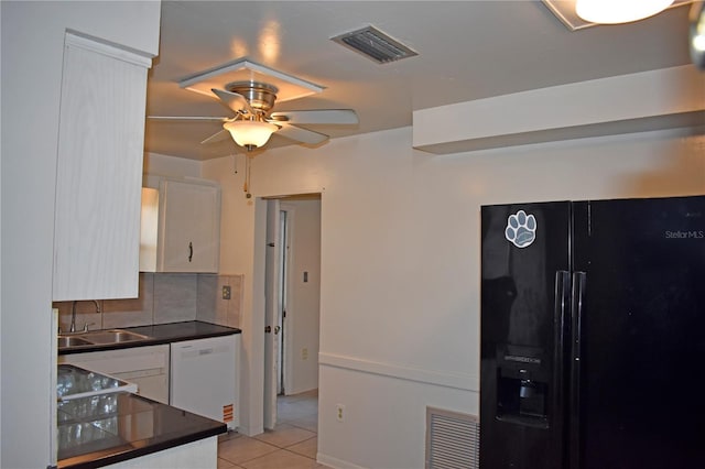 kitchen featuring white cabinetry, light tile patterned floors, black fridge with ice dispenser, and dishwasher