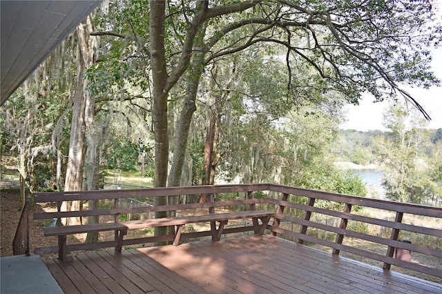 wooden terrace with a water view