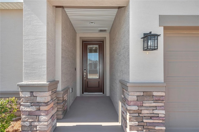 property entrance with a garage