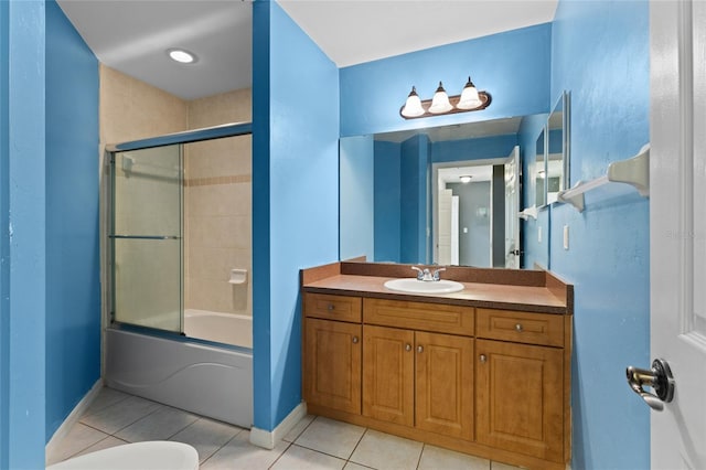 bathroom with vanity, bath / shower combo with glass door, and tile patterned flooring