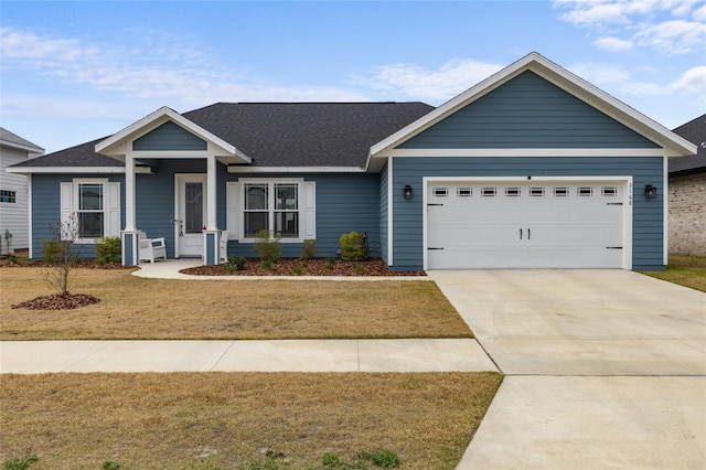 craftsman inspired home with a garage and a front yard