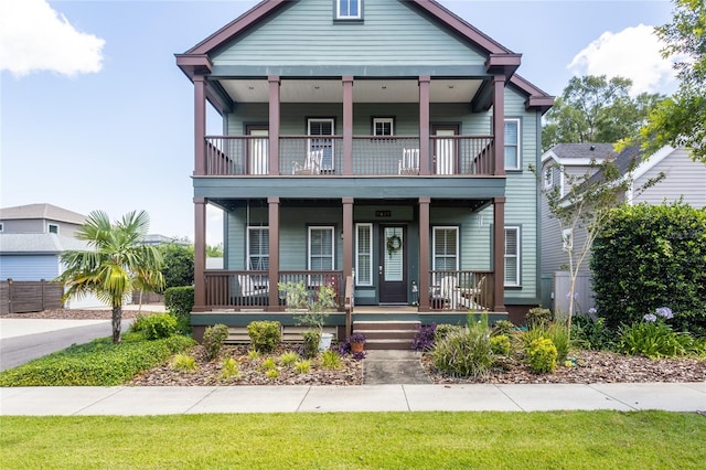 view of front of home featuring a porch and a balcony