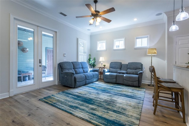 living room featuring visible vents, wood finished floors, and french doors