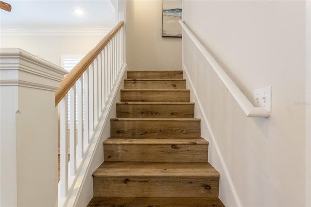 stairs featuring crown molding and recessed lighting