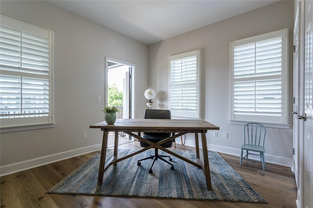 office area with baseboards and wood finished floors